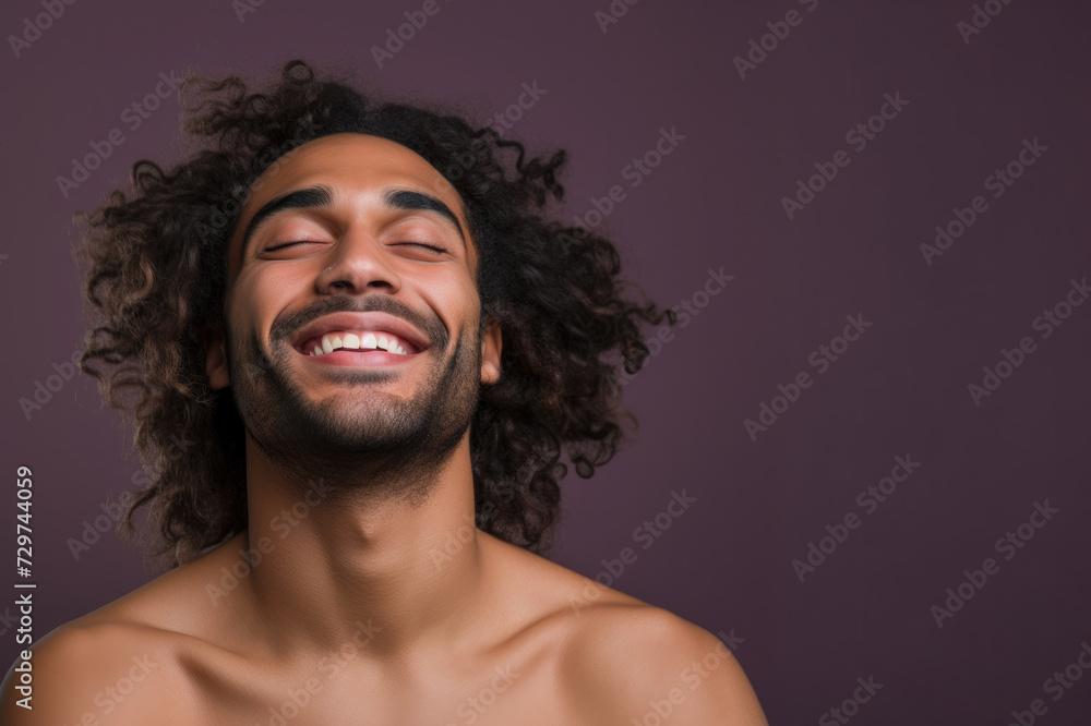 Horizontal portrait of a happy handsome fashion man smiling, solid light color background Horizontal portrait of a happy handsome fashion man smiling, solid light color background
