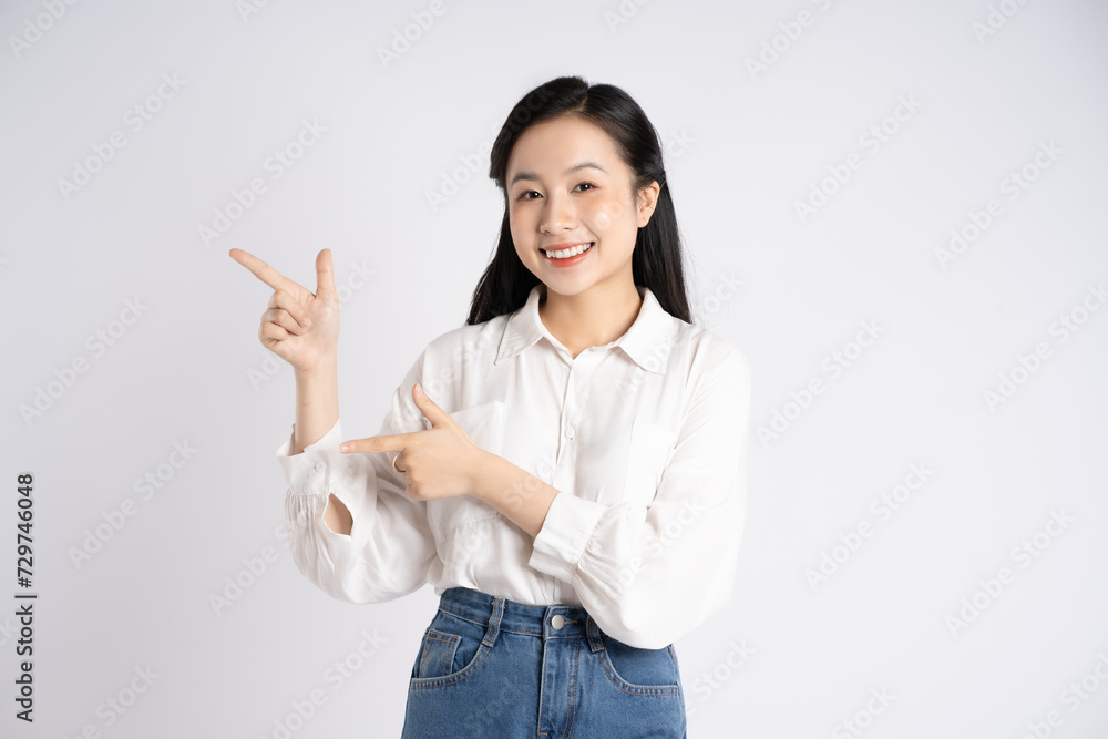 Portrait of young Asian businesswoman posing on white background Portrait of young Asian businesswoman posing on white background
