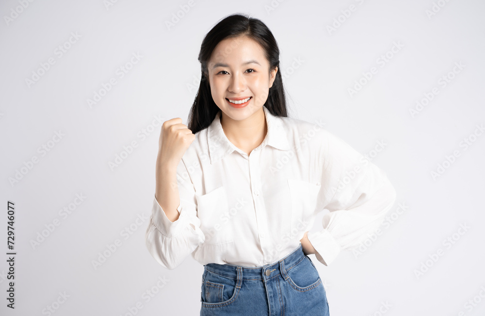 Portrait of young Asian businesswoman posing on white background