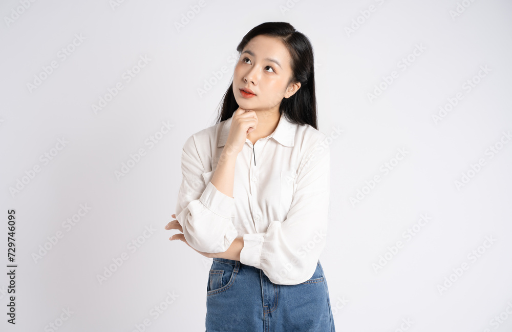 Portrait of young Asian businesswoman posing on white background Portrait of young Asian businesswoman posing on white background