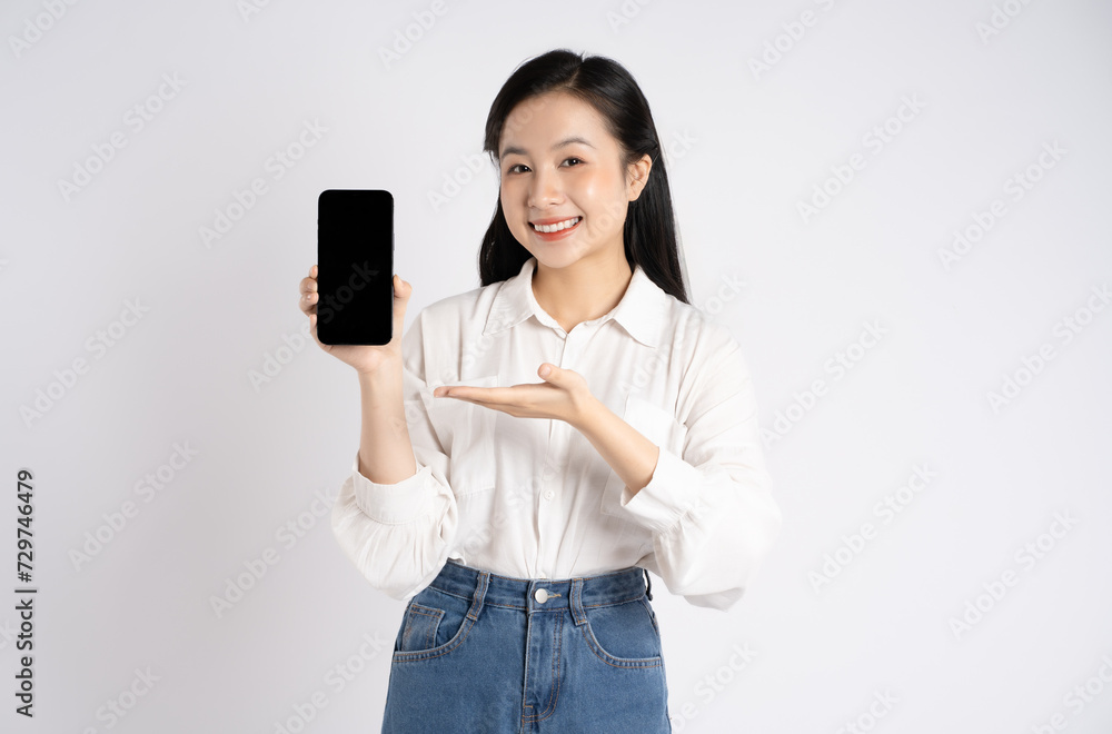 Portrait of young Asian businesswoman using phone on white background Portrait of young Asian businesswoman using phone on white background