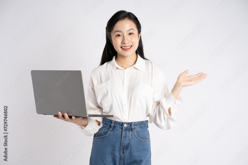 Portrait of young Asian businesswoman using laptop on white background Portrait of young Asian businesswoman using laptop on white background