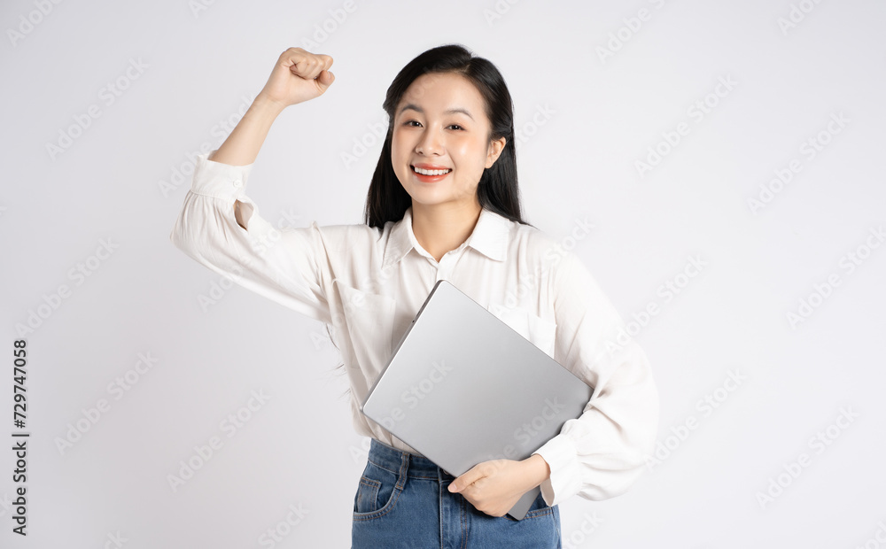 Portrait of young Asian businesswoman using laptop on white background Portrait of young Asian businesswoman using laptop on white background