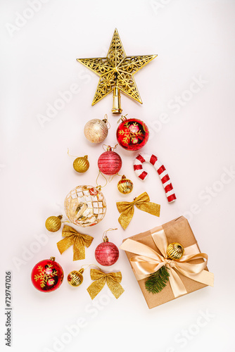 New Year tree made of gifts and New Year's balls. Christmas decor. Gold star, red balls. New Year tree made of balls.