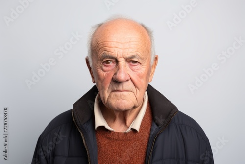 Portrait of an elderly man with a sad expression on his face