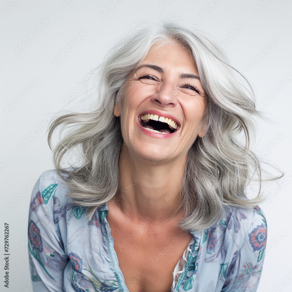 Beautiful elderly senior model woman with grey hair laughing and smiling. isolated on white background Beautiful elderly senior model woman with grey hair laughing and smiling. isolated on white background