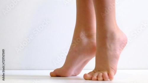 Barefoot, tiptoe legs, position, practicing in ballet studio, white background