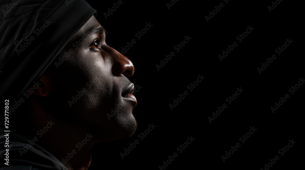Close up picture of the profile face of a black man Close up picture of the profile face of a black man