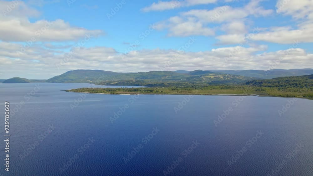 Ascending flyover of Huillinco Lake on a sunny day, Chonchi, Chiloé Island, Chile Ascending flyover of Huillinco Lake on a sunny day, Chonchi, Chiloé Island, Chile