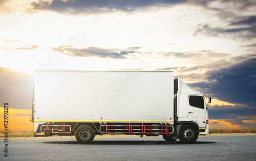 Container Trucks Driving on The Road with The Sunset Sky. Shipping Cargo Container, Economical Transportation Business. Commercial Truck Transport. Diesel Trucks. Lorry. Freight Truck Logistics.