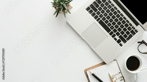 Workspace on the white table mockup, with laptop, pens for notes,  cup of coffee, notepad and plant succulents, flat lay, copy space