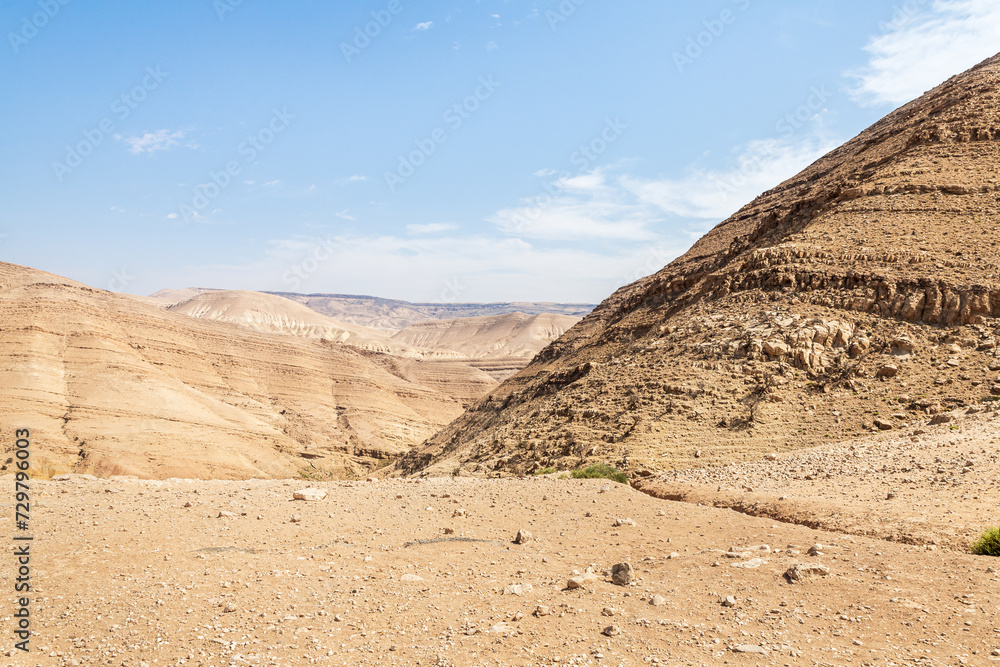 View of low mountains in gorge Wadi Al Ghuwayr or An Nakhil and wadi Al Dathneh from road leading to it near Amman in Jordan