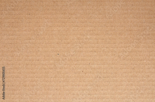 Cardboard sheet texture background, detail of recycle brown paper box pattern.