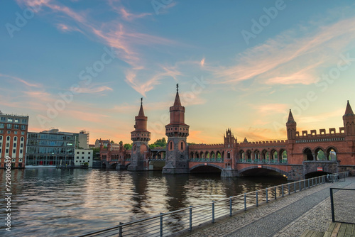 Berlin Germany, sunset city skyline at Oberbaum Bridge and Spree River photo