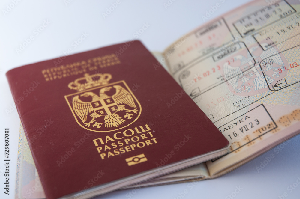Serbian passport on a white background. Top view. Flat lay. Serbian passport on a white background. Top view. Flat lay.
