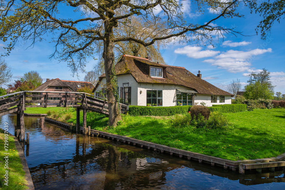 Giethoorn Netherlands, city skyline at canal and traditional house in Giethoorn village