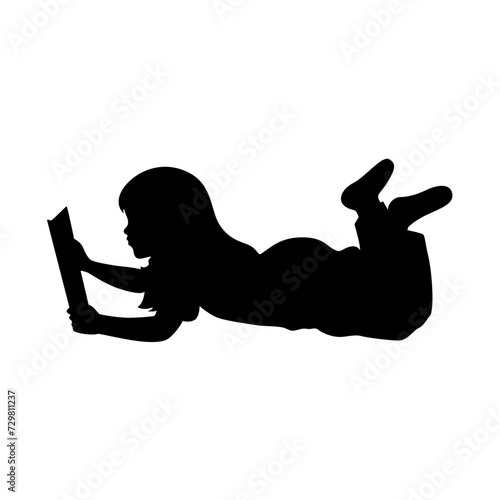Little girl lying on the floor, reading a book silhouette, love reading concept