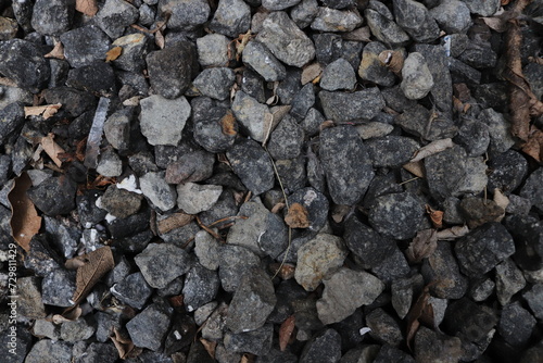 Wallpaper Mural The surface with piles of gravel/stone accompanied by dry leaf fragments, plastic waste fragments and paper fragments Torontodigital.ca