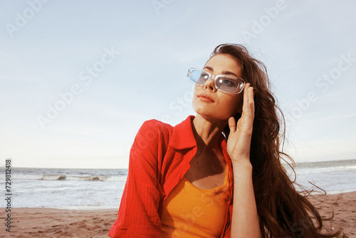 Colorful Summer: Smiling Woman Embracing Freedom at the Beach, Enjoying the Ocean Sunset