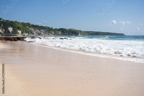 beach with rocky mountains and clear water of Indian ocean at sunny day . 