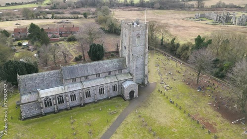 St. james the great church near castle acre with surrounding cemetery and ruins, overcast day, aerial view photo