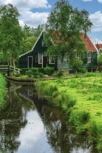 Picturesque view of traditional Houses by the Canal in the Historic Village of Zaanse Schans, The Netherlands