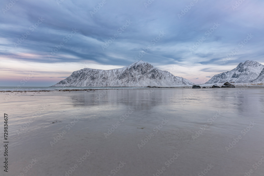 norway lofoten islands winter season snow covered landscapes beaches cloudy sky and colorful houses