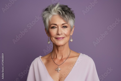 Portrait of a beautiful mature woman with grey hair and professional makeup