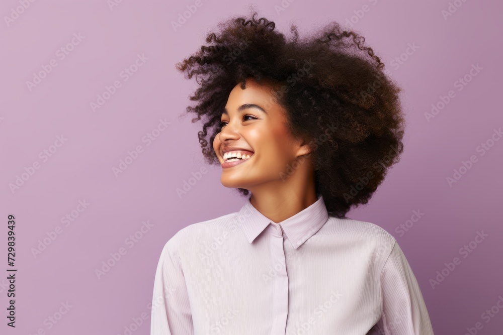 Beautiful african american woman with afro hairstyle on purple background Beautiful african american woman with afro hairstyle on purple background