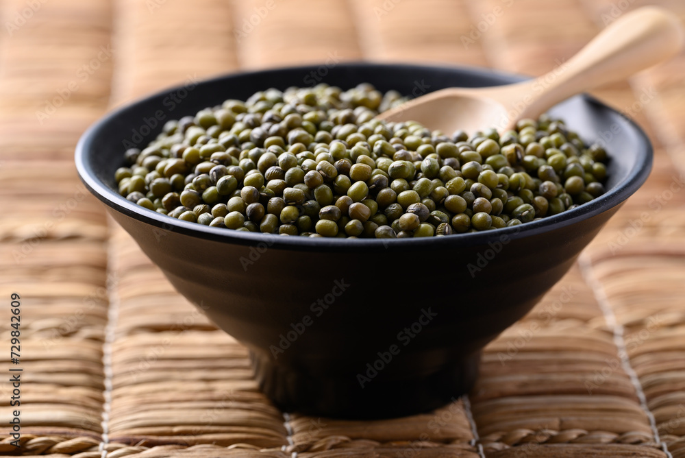Green mung bean in black bowl with spoon, Food ingredients Green mung bean in black bowl with spoon, Food ingredients