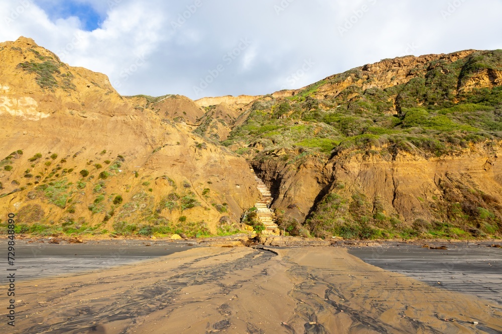 Mud River Flowing Down Sandstone Cliffs at Torrey Pines California State Park after Historic Atmospheric Rain Storm Floods in San Diego, Southern California, USA