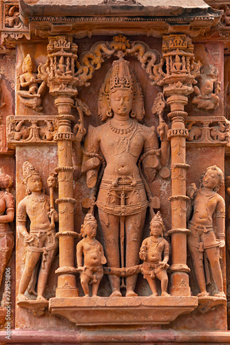 Carved Sculpture of Lord Vishwakarma on the Sun Temple of Jhalarapatan, Rajasthan, India.
