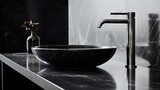 Black marble sink and chrome faucet in a modern bathroom with minimalist style