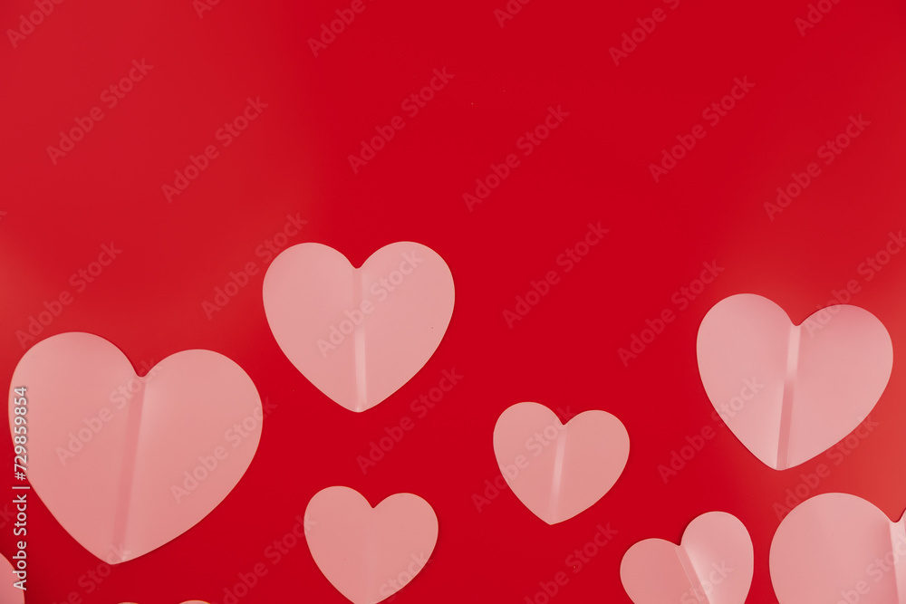 Valentine's Day concept. Valentines Day background. Postcard with hearts on a red background. Flat lay, top view, copy space. Valentine's day celebration