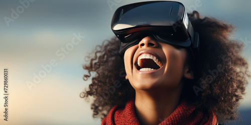 Portrait of happy woman wearing virtual reality glasses on a sky background. Concept of using modern technology by people.Copy space for text © syhin_stas