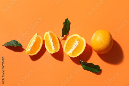 Fresh oranges and green lea...