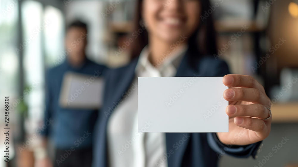 A Woman Is Holding A Business Card A Woman Is Holding A Business Card
