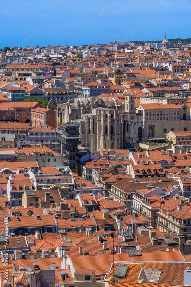 Aerial view from the Castle of Saint George with panoramic views of the Church of the Convento do Carmo and the Elevador de Santa Justa elevator, with the roofs of the city of Lisbon, Portugal