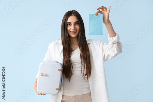 Young woman holding mini sk...