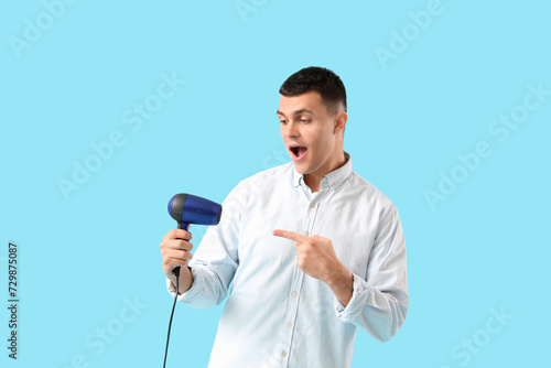 Handsome young man pointing...