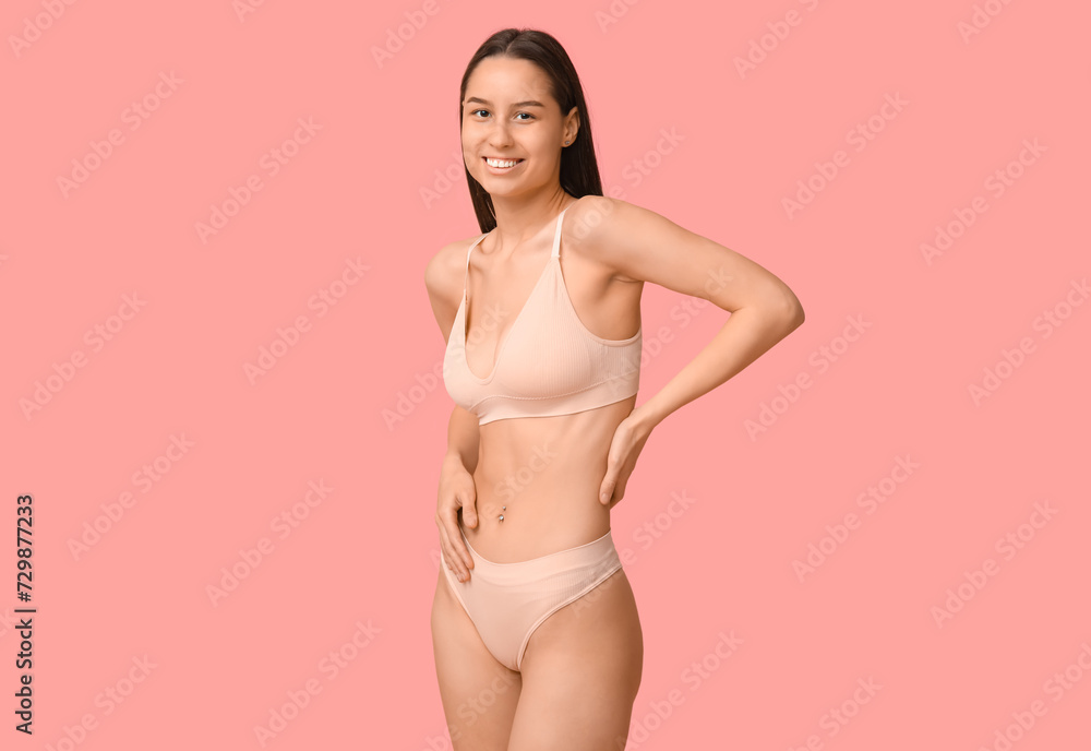 Beautiful young woman in underwear on pink background Beautiful young woman in underwear on pink background