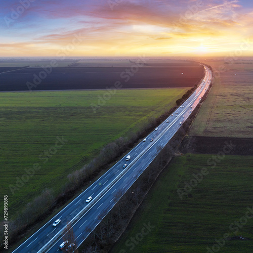 Drone view of Highway line transportation with cars and Truck, Traffic at sunset