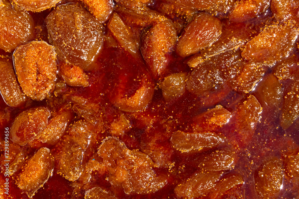 Fig jam close up, texture and pattern with boiled jam. Background. Soft focus. Fig jam close up, texture and pattern with boiled jam. Background. Soft focus.