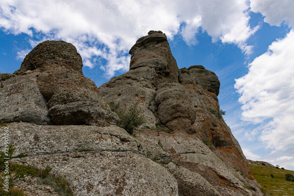 Mountain canyon, gray limestone cliffs in the form of pillars formed under the action of natural forces. Mountain canyon, gray limestone cliffs in the form of pillars formed under the action of natural forces.