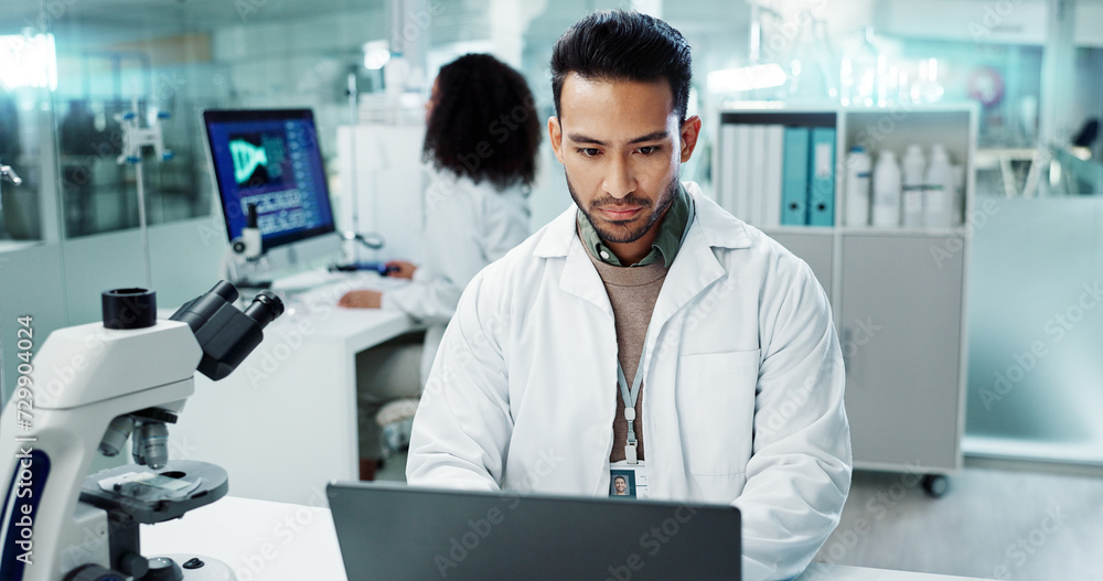 Scientist, man and reading computer for laboratory test, typing report or medical results of DNA at night. Asian expert thinking on computer for science research, biotechnology and molecule analysis Scientist, man and reading computer for laboratory test, typing report or medical results of DNA at night. Asian expert thinking on computer for science research, biotechnology and molecule analysis