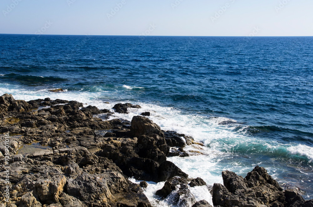Sea coast with dark stones, landscape