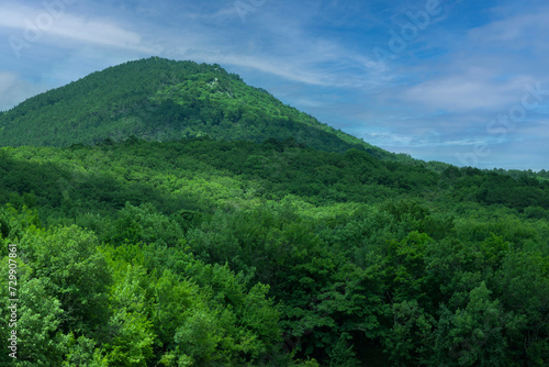 Landscape, Big green mountain peak against the blue sky in the early morning. selective focus