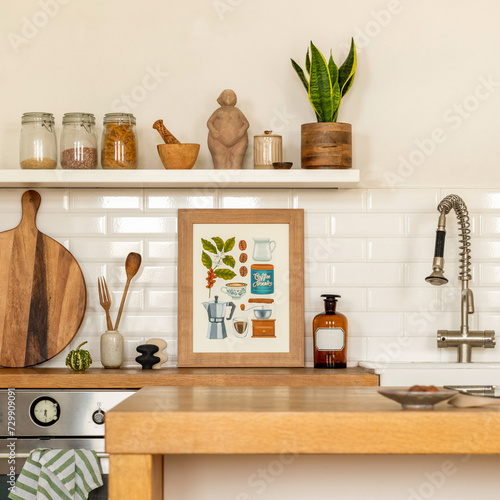 Interior design of dining room interior with mock up poster frame, wooden kitchen island, silver tap, plant, white tiles on wall, round cutting board and kitchen accessories. Home decor. Template.