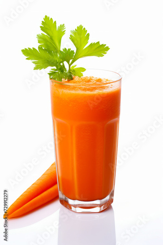 Carrot and glass of carrot juice on white background.