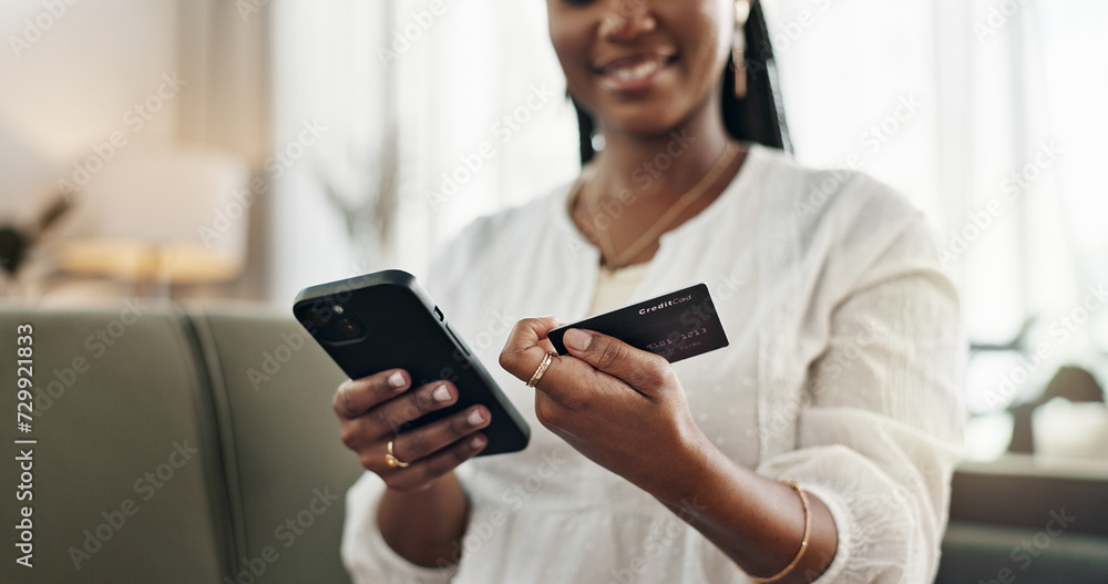 Hands, woman and credit card with smartphone on sofa for online shopping, payment and fintech at home. Closeup, mobile banking and finance for sales, password and code for ecommerce, money or savings Hands, woman and credit card with smartphone on sofa for online shopping, payment and fintech at home. Closeup, mobile banking and finance for sales, password and code for ecommerce, money or savings